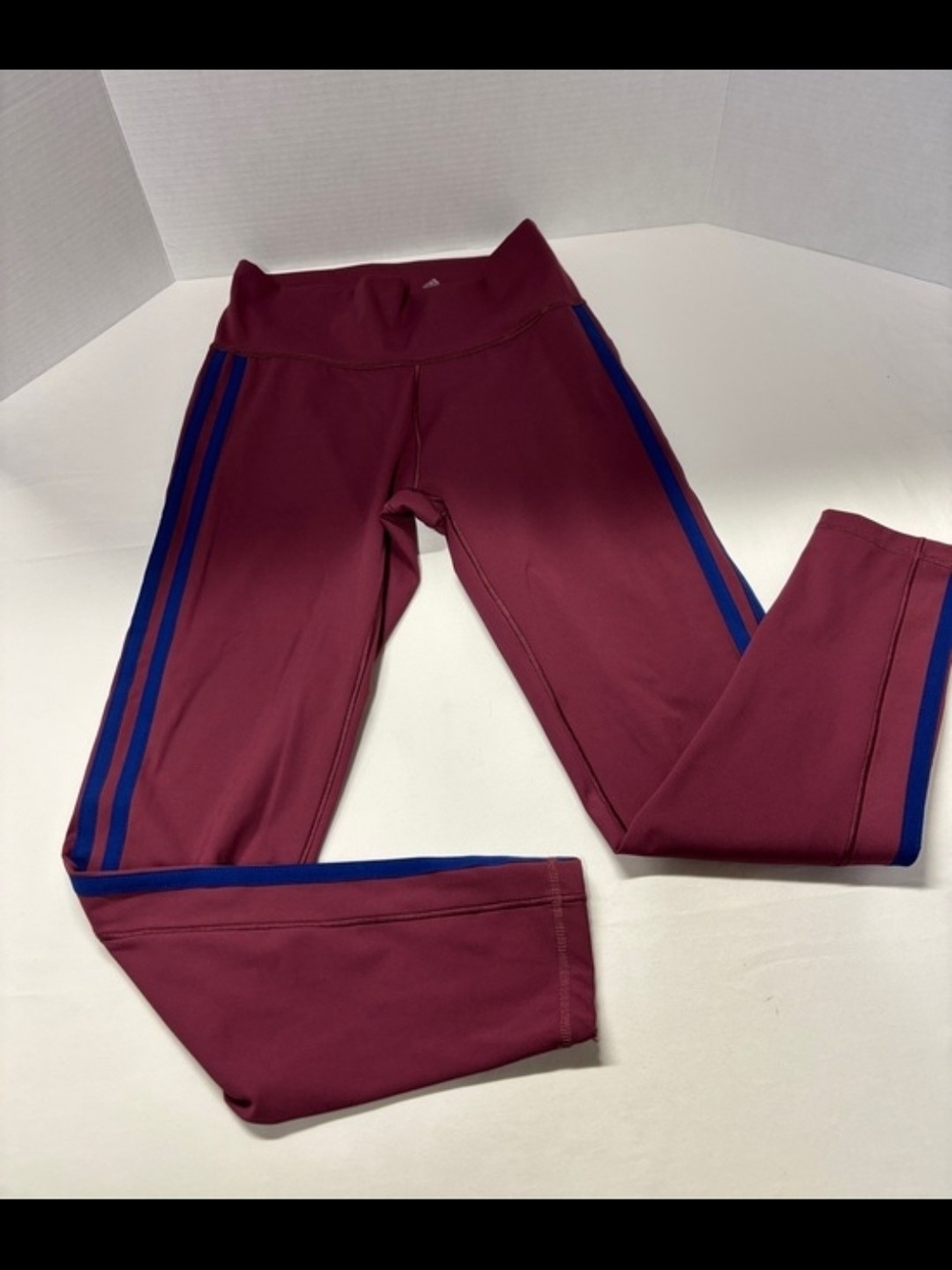 Girls Burgundy Active Leggings with Blue Stripe.